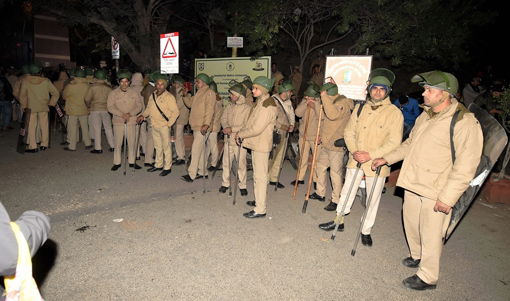 New Delhi: Policemen at out side of the JNU after some masked miscreants attacked in the campus, New Delhi, Sunday, Jan 05, 2020. (PTI Photo/Shahbaz Khan) (PTI1 5 2020 000192B)
