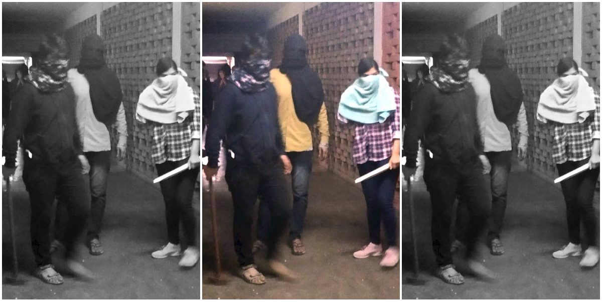 **EDS: TWITTER IMAGE RELEASED BY @JNUSUofficial , JAN. 5, 2020** New Delhi: Masked miscreants armed with sticks roaming around campus, at JNU, New Delhi, Sunday. (PTI Photo) (PTI1_5_2020_000172B)