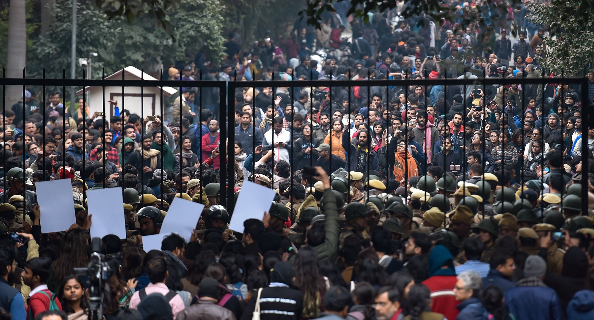 New Delhi: Students stage a protest at main Gate of JNU over Sunday's violence, in New Delhi, Monday, Jan. 6, 2020. A group of masked men and women armed with sticks, rods and acid allegedly unleashed violence on the campus of the University in New Delhi, Sunday evening.(PTI Photo/Atul Yadav)(PTI1_6_2020_000147B)