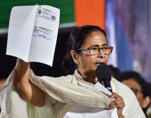 Kolkata: West Bengal Chief Minister Mamata Banerjee shows a document while addressing TMC Chhatra Parshad (TMC students wing) students during their protest dharma against CAA, NPR and NRC in Kolkata, Wednesday, Jan. 15, 2020. (PTI Photo/Swapan Mahapatra) (PTI1_15_2020_000215B)