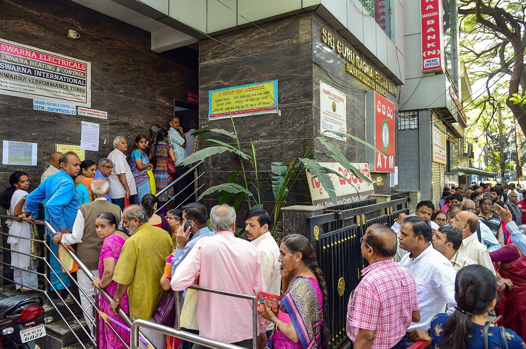 Bengaluru: Depositors stand in queue to withdraw money from Sri Guru Raghavendra Sahakara Bank in Bengaluru, Tuesday, Jan.14, 2020. The Reserve Bank of India (RBI) has curbed Sri Guru Raghavendra Sahakara bank from doing business with immediate effect for alleged irregularities in transactions. (PTI Photo/Shailendra Bhojak)(PTI1_14_2020_000047B)