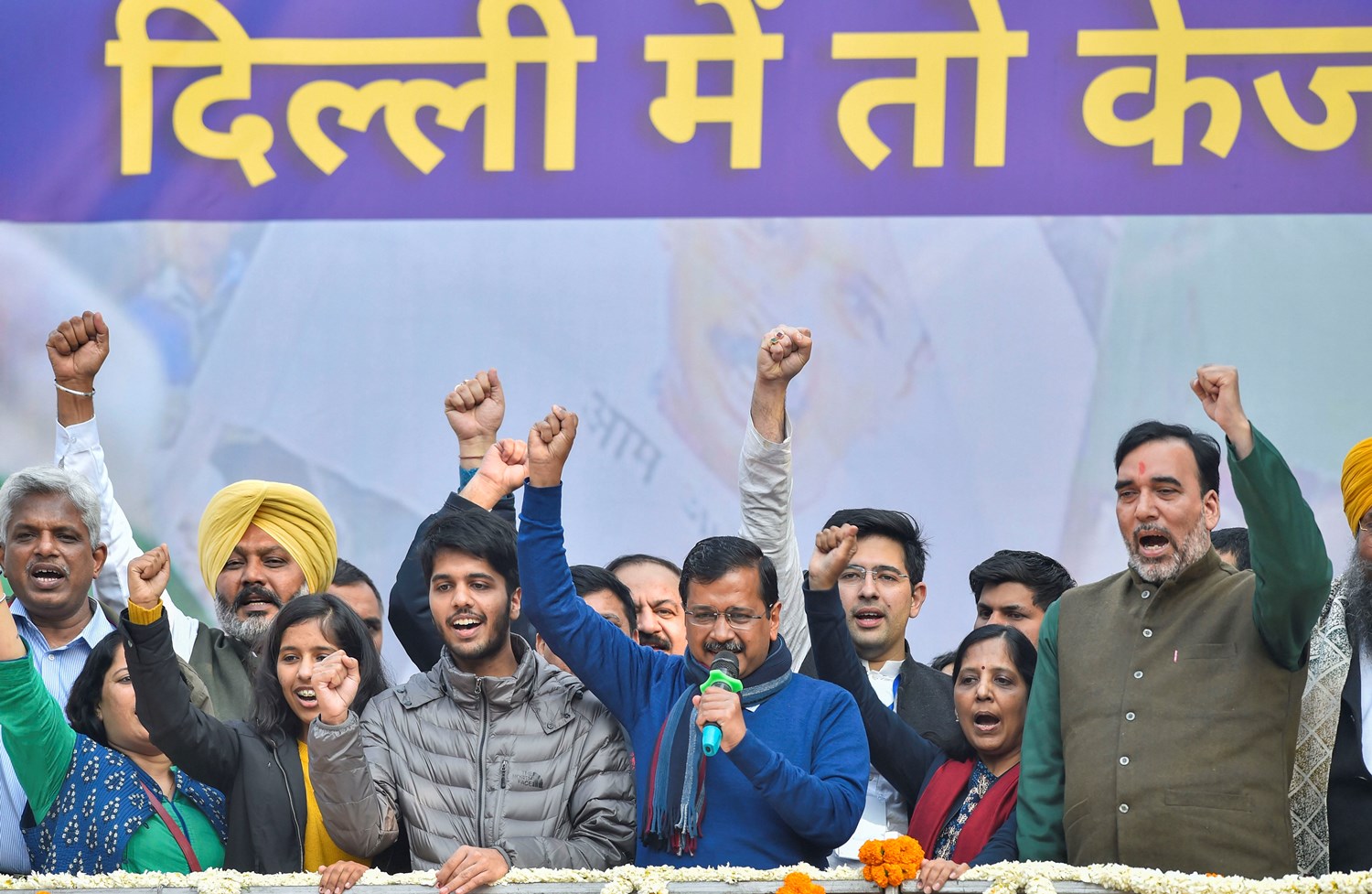 New Delhi: Delhi CM and AAP convenor Arvind Kejriwal (C) addreses supporters after party's victory in the State Assembly polls, at AAP office in New Delhi, Tuesday, Feb. 11, 2020. Kejriwal's wife Sunita, daughter Harshita, son Pulkit and party leaders Gopal Rai, Raghav Chadha are also seen. (PTI Photo/Ravi Choudhary)(PTI2_11_2020_000140B)