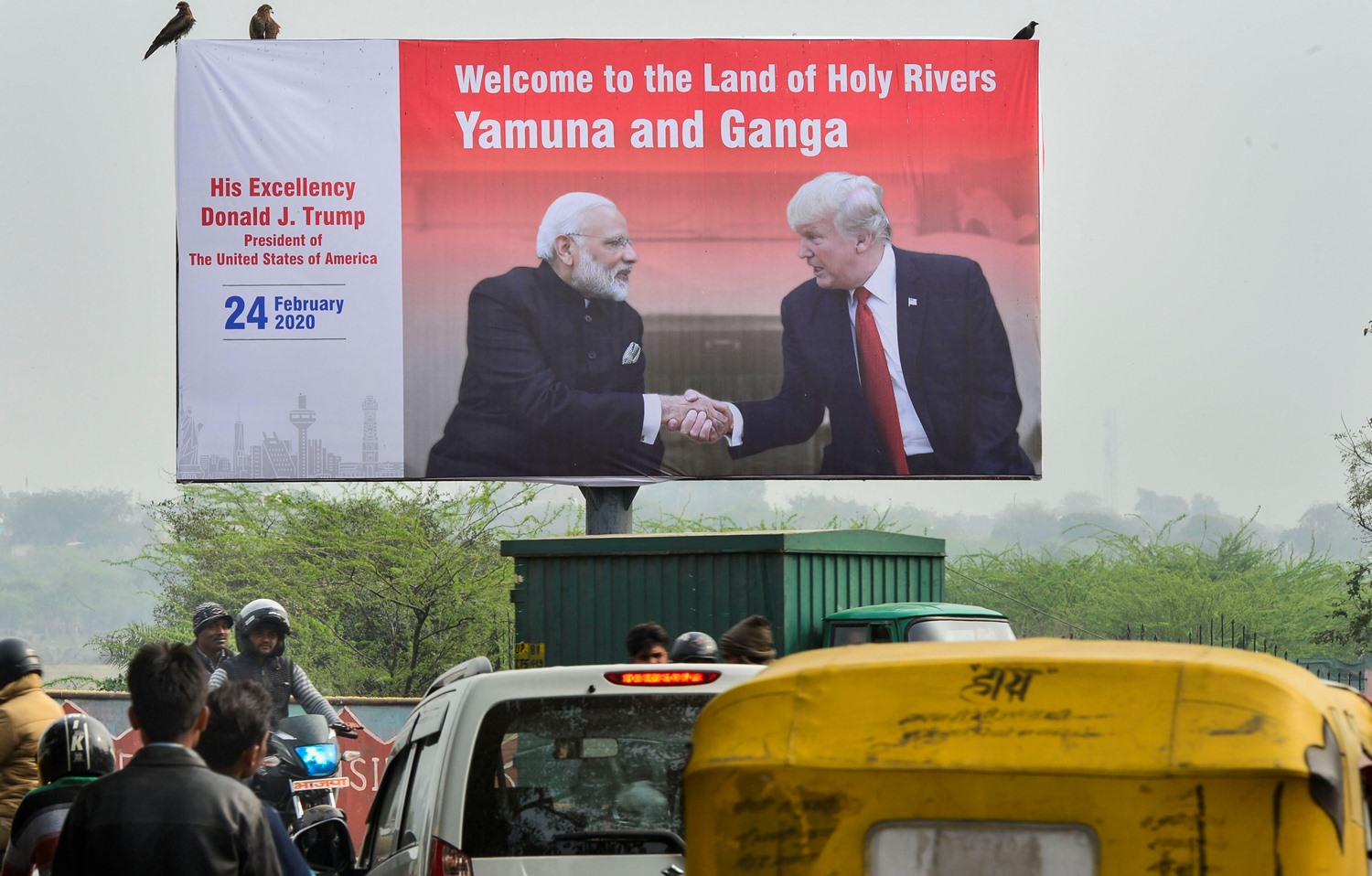 Agra: A billboard with the pictures of Prime Minister Narendra Modi and U. S. President Donald Trump put up along side a road, ahead of Trump’s visit to Agra, Saturday, Feb. 22, 2020. (PTI Photo/ Kamal Kishore) (PTI2 22 2020 000034B)