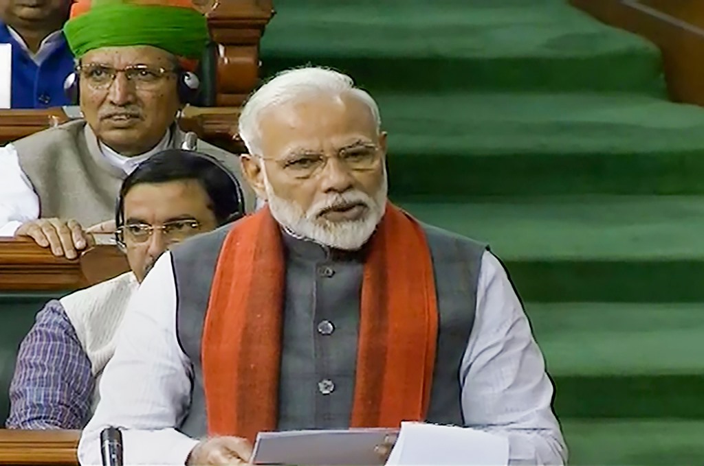 *EDS: TV GRAB** New Delhi: Prime Minister Narendra Modi rises to make a statement in the Lok Sabha, during the ongoing Budget Session of Parliament in New Delhi, Wednesday, Feb. 5, 2020. PM Modi announced the formation of a trust for the construction of a Ram Temple in Ayodhya as directed by the Supreme Court in its verdict in the Ram Janmabhoomi-Babri Masjid case in November last year. (LSTV/PTI Photo) (PTI2 5 2020 000026B)