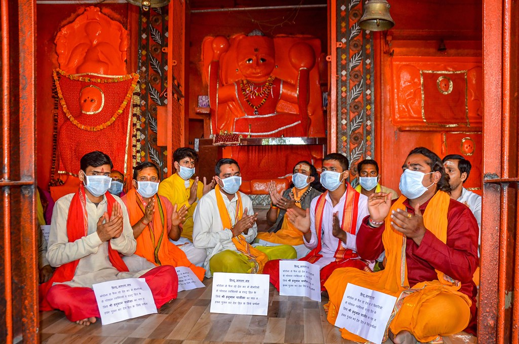 Mirzapur: Priest offer prayers for speedy recovery of those affected by coronavirus, at Hanuman temple in Mirzapur, Monday, March 16, 2020. (PTI Photo)(PTI16-03-2020_000113B)