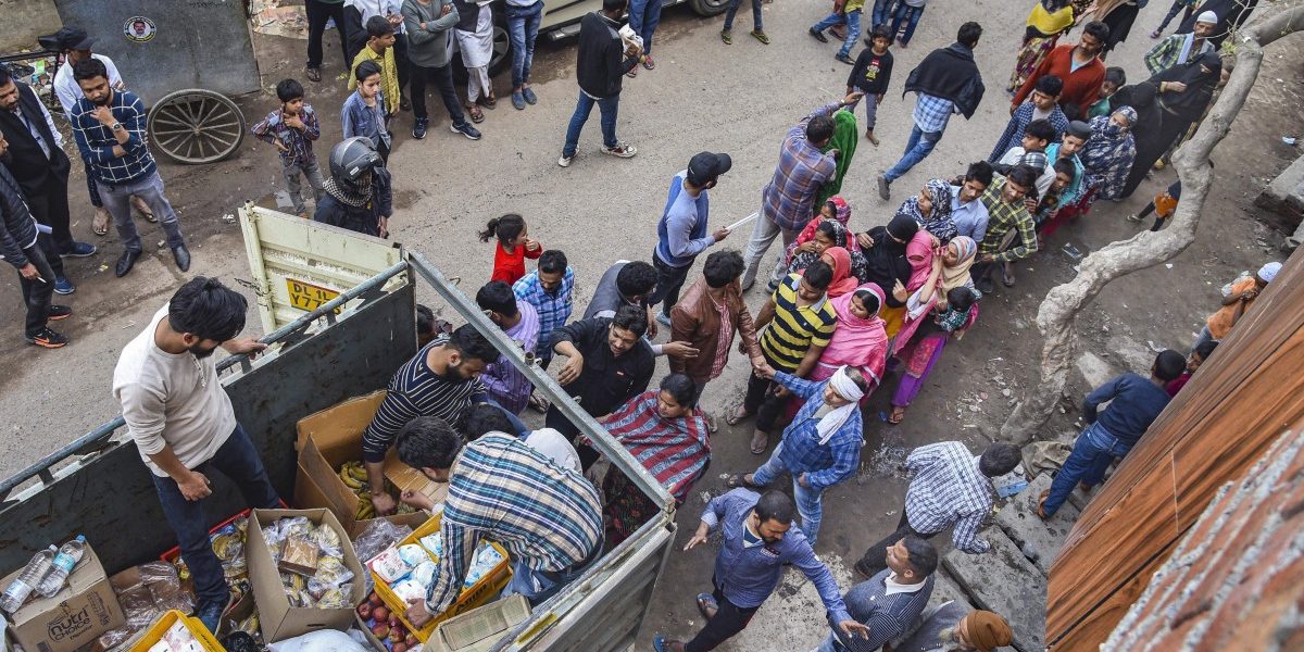 Civil society groups distribute relief material in riot-affected areas on Sunday, March 1st. Photo: PTI