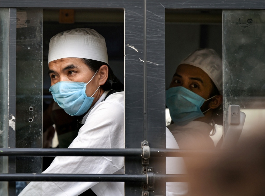 New Delhi: Members of the Tablighi Jamaat leave in a bus from LNJP hospital for the quarantine centre during the nationwide lockdown, in wake of the coronavirus pandemic, in New Delhi, Tuesday, April 21, 2020. (PTI Photo/Manvender Vashist) (PTI21-04-2020_000208B)
