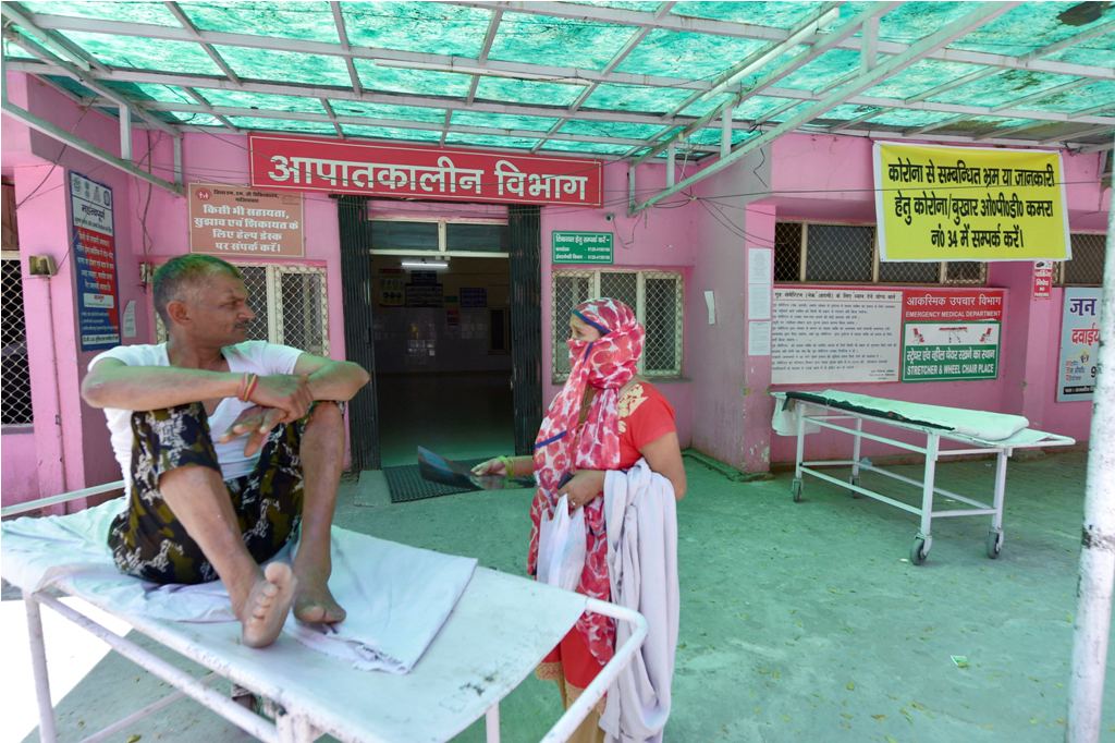 Ghaziabad: A patient waits outside the emergency ward of Ghaziabad District MMG hospital, where attendees of a recent religious congregation in Nizamuddin are admitted for quarantine in the wake of coronavirus outbreak, in Ghaziabad (UP), Saturday, April 4, 2020. (PTI Photo/Vijay Verma)(PTI04-04-2020_000056B)