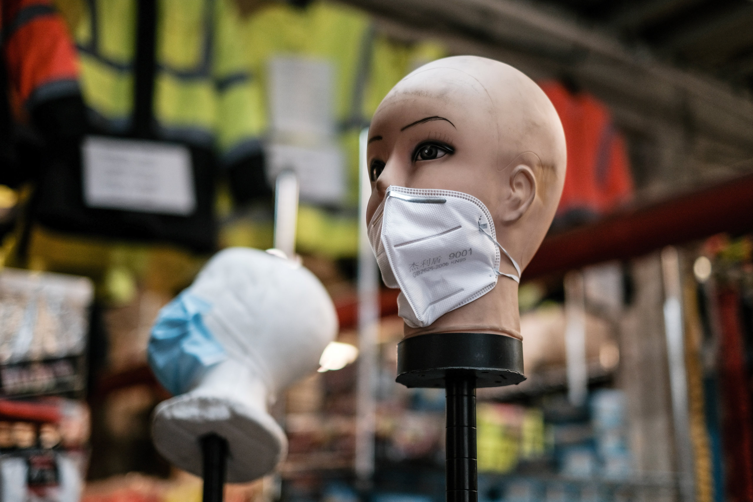 FILE PHOTO: A mannequin displays disposable face masks at a safety equipment store in the Brooklyn borough of New York City, U.S., March 26, 2020. REUTERS/Stephen Yang/File Photo