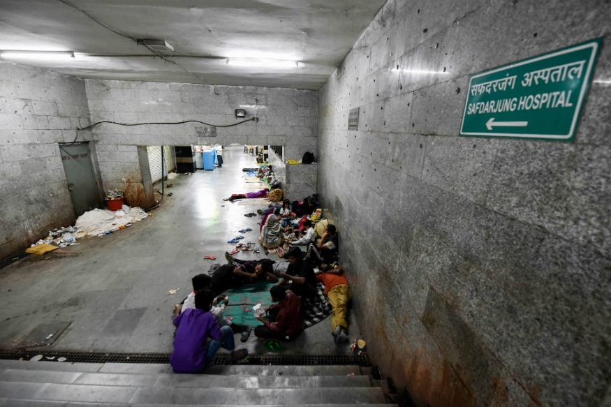Discharged patients and their attendants, who were admitted to AIIMS, take refuge amidst unhygienic conditions at a subway near the hospital during the nationwide lockdown, in New Delhi on April 4, 2020. (PTI Photo/Manvender Vashist)