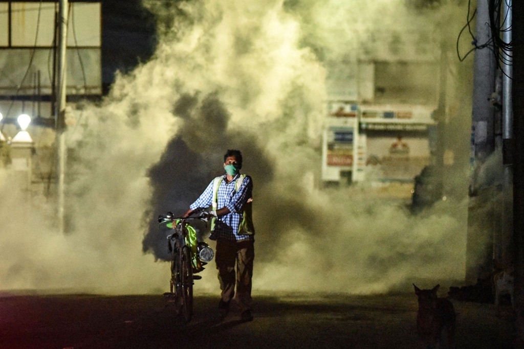 Vijayawada: A corporation worker fumigates chemical smoke during fumigation drive amid the ongoing COVID-19 lockdown, in Vijayawada, Monday, May 25, 2020. (PTI Photo)(PTI25-05-2020 000368B)