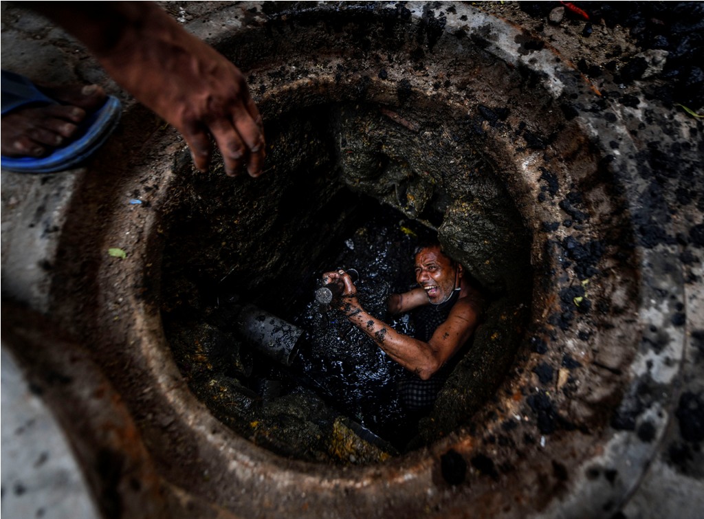 Ghaziabad: Phoolu (45), a full-time worker shows his hands after cleaning a manhole, during the ongoing COVID-19 lockdown, in Ghaziabad, Friday, May 01, 2020. Phoolu has a daughter and has been working since he was 10 years of age. He continues choicelessly to work inside sewer lines to earn a living amid this pandemic, exposing his body to added risk. (PTI Photo/Ravi Choudhary)(PTI01-05-2020_000090B)
