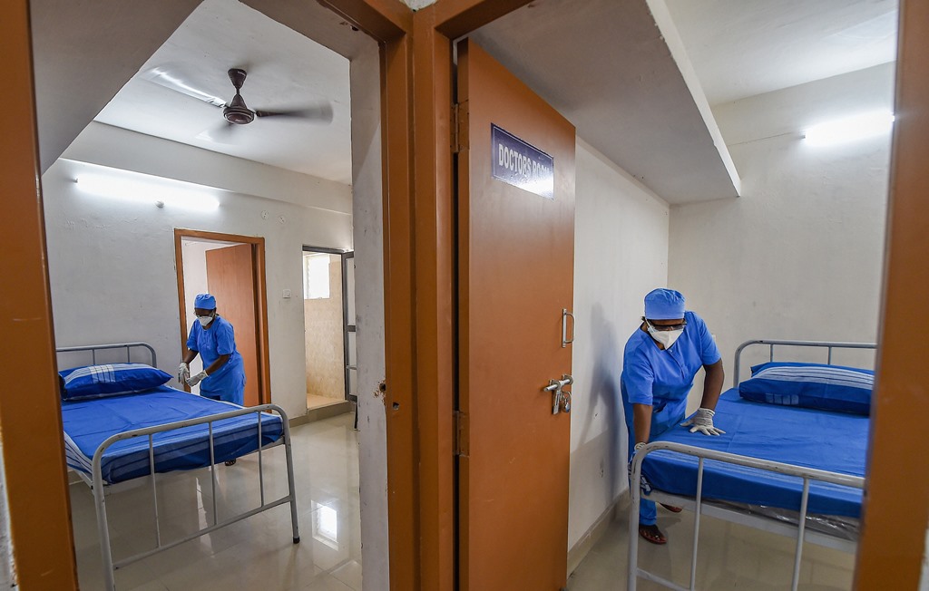 Chennai: Health workers prepare a temporary set-up of 1450 beds for COVID-19 patients, during the ongoing nationwide lockdown, in Chennai, Saturday, May 30, 2020. Tamil Nadu Housing board quarters converted into a COVID Care Centre for quarantine. (PTI Photo/R Senthil Kumar)(PTI30-05-2020_000061B)