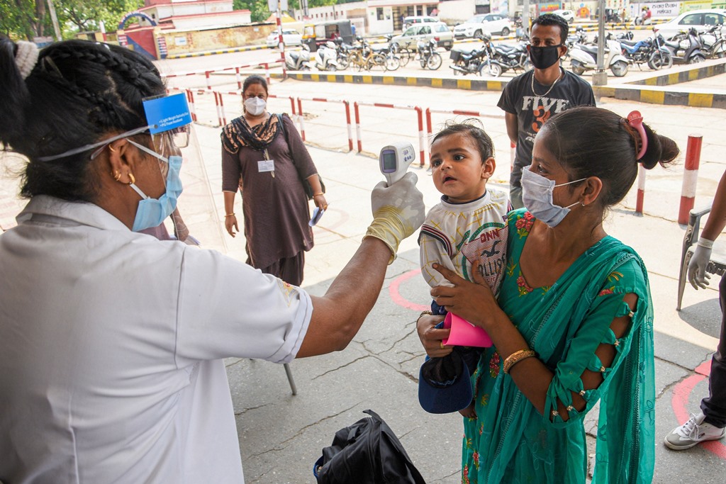 Jalandhar: Passengers undergo thermal screening at a railway station  before boarding a train, during the ongoing COVID-19 lockdown, in Jalandhar, Monday, June 1, 2020. (PTI Photo)(PTI01-06-2020_000357B)