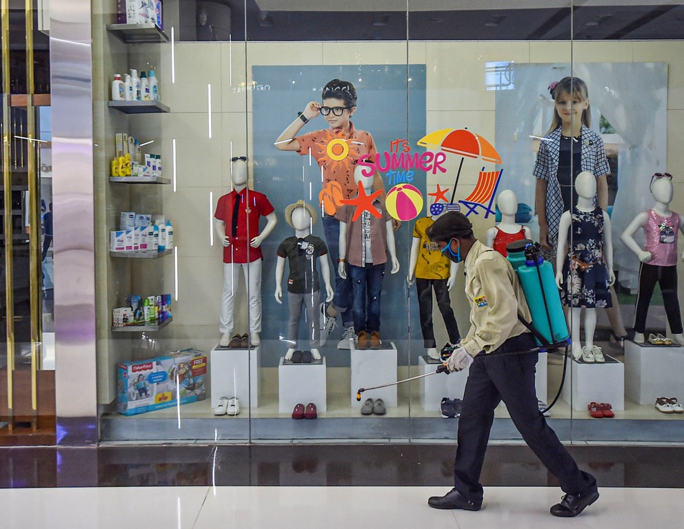 Kolkata: A worker sprays disinfectant inside a shopping mall ahead of its reopening during the fifth phase of nationwide COVID-19 lockdown, in Kolkata, Saturday, June 6, 2020. (PTI Photo/Swapan Mahapatra)(PTI06-06-2020 000185B)