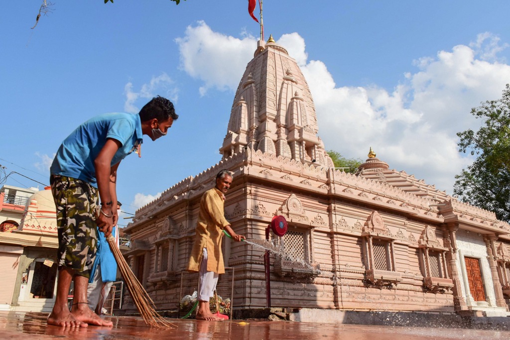 Jabalpur: A worker cleans the premises of Goddess Khermai temple, ahead of its re-opening, during the ongoing COVID-19 lockdown, in Jabalpur, Saturday, June 6, 2020. (PTI Photo)(PTI06-06-2020 000164B)