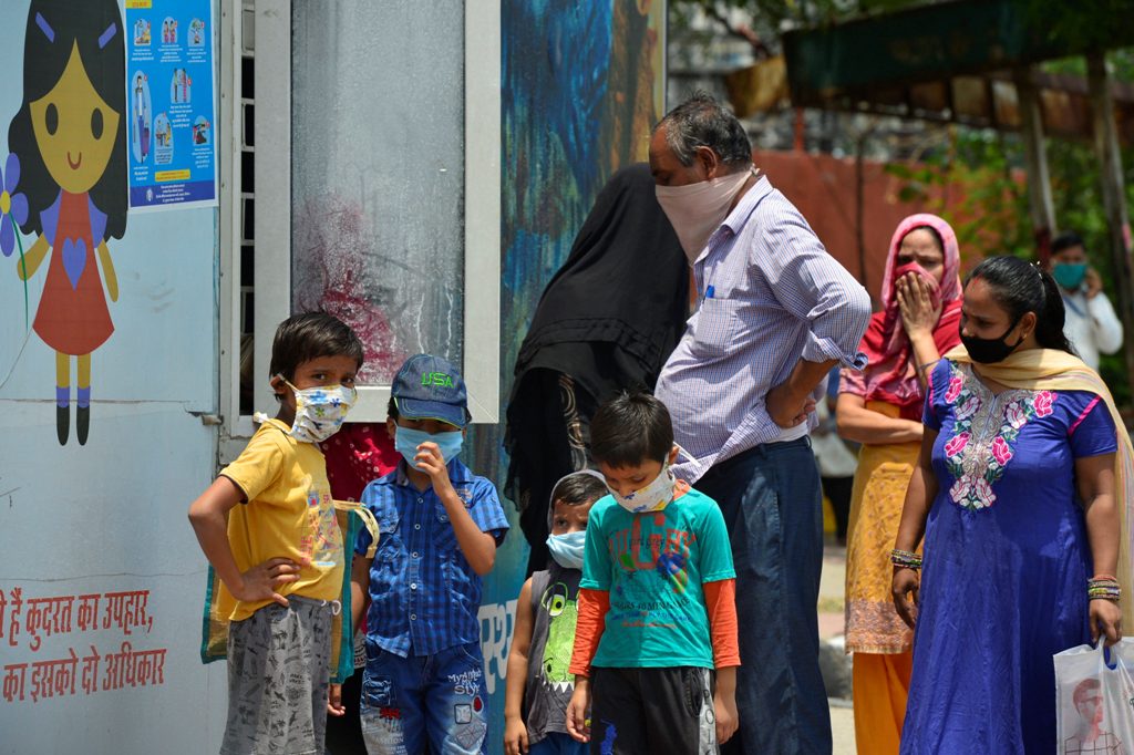 New Delhi: People wait at a Mohalla clinic to get medicines, during the fifth ongoing COVID-19 lockdown, in New Delhi, Wednesday, June 10, 2020. (PTI Photo/Kamal Kishore)(PTI10-06-2020 000115B)