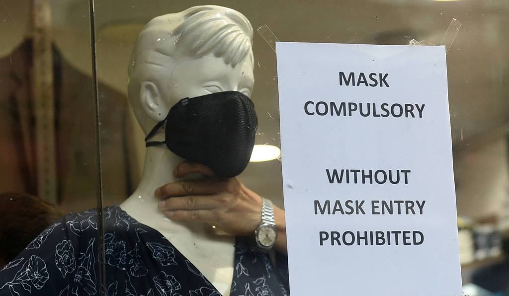Kolkata: A notice on No Entry Without Mask is placed next to a mannequin with a face mask on it at a shop, during Unlock 1.0, in Kolkata, Saturday, June 27, 2020. (PTI Photo/Ashok Bhaumik)