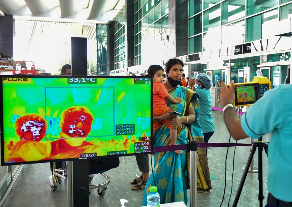 Bengaluru: Passengers undergo thermal screening at Kempegowda International airport after authorities eased restrictions, amid the ongoing COVID-19 nationwide lockdown, in Bengaluru, Tuesday, June 2, 2020. (PTI Photo/Shailendra Bhojak)