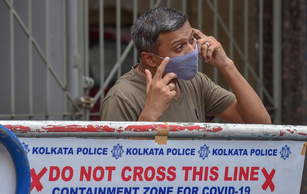 Kolkata: A resident speaks on the phone outside a sealed residential complex at Bhawanipore area, following emergence of COVID-19 cases, during Unlock 2.0, in Kolkata, Saturday, July 18, 2020. (PTI Photo/Swapan Mahapatra)(PTI18-07-2020 000068B)