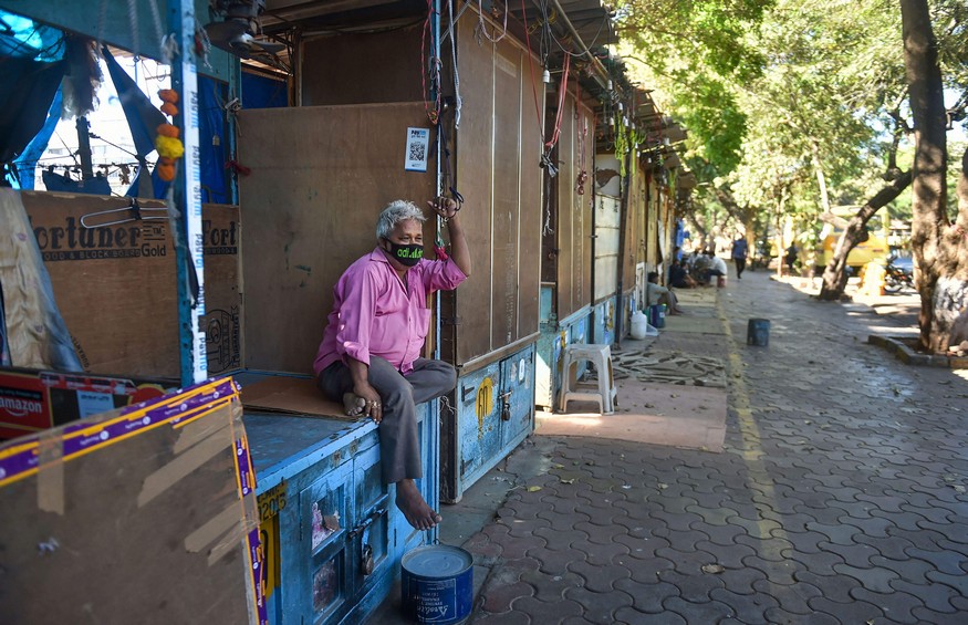 Mumbai: A man wearing a protective mask in the wake of coronavirus pandemic, sits at one of the closed shops at Fashion Street, in Mumbai, Thursday, March 19, 2020. (PTI Photo/Mitesh Bhuvad)(PTI19-03-2020_000157B)