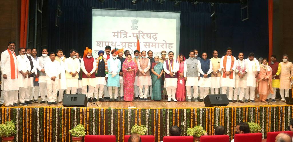Bhopal: Madhya Pradesh Governor Anandiben Patel and Chief Minister Shivraj Chouhan pose for a group photo with the newly inducted ministers of the State Cabinet, after the swearing-in ceremony at Raj Bhawan in Bhopal, Thursday, July 2, 2020. (PTI Photo) (PTI02-07-2020 000089B)