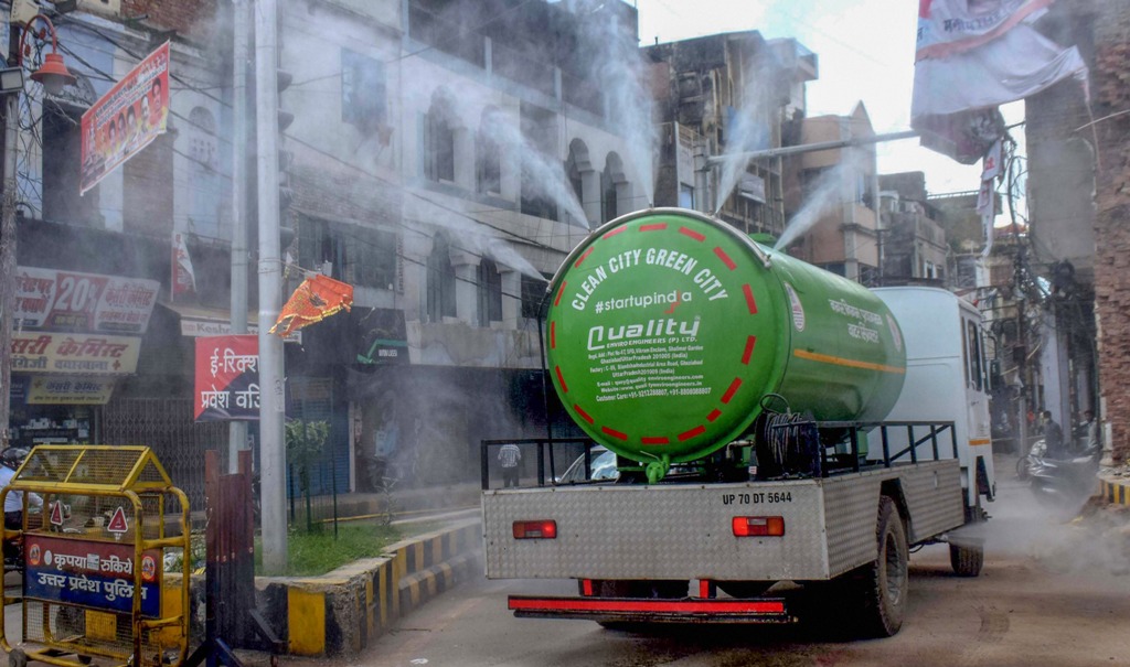  Allahabad: Municipal workers use a water tanker, modified to spray disinfectants, to sanitise a locality as COVID-19 cases surge, in Allahabad, Saturday, Aug. 8, 2020. (PTI Photo)