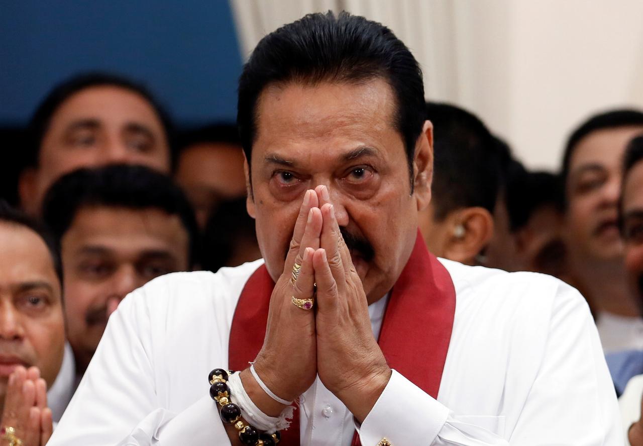 Sri Lanka's newly appointed Prime Minister Mahinda Rajapaksa gestures during the ceremony to assume duties at the Prime Minister's office in Colombo, Sri Lanka October 29, 2018. REUTERS/Dinuka Liyanawatte/Files