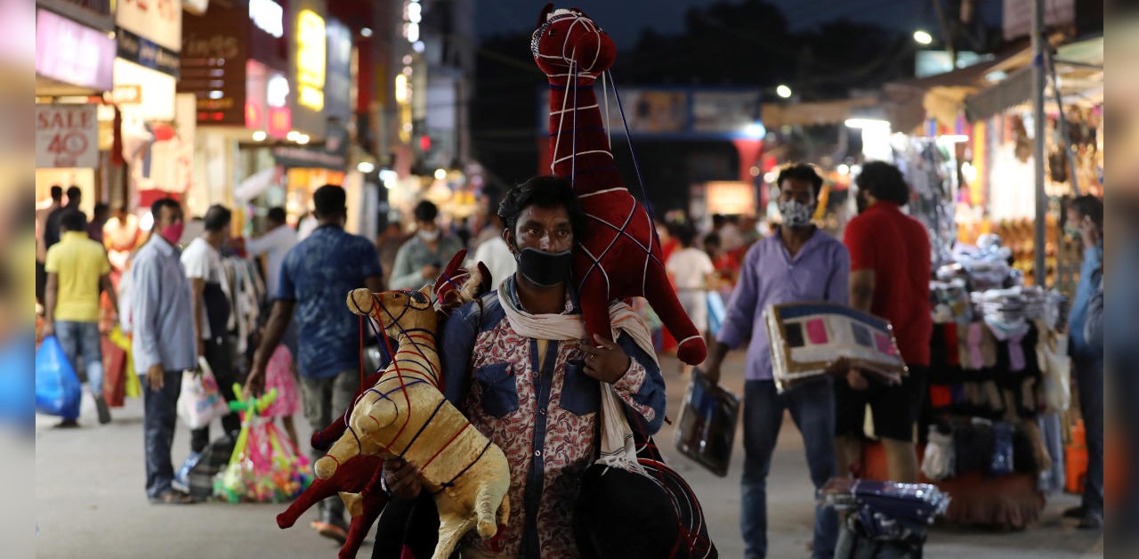 A man selling stuffed toys waits for customers at a market amidst the spread of the coronavirus, in New Delhi, India, September 16, 2020. Credit: Reuters Photo