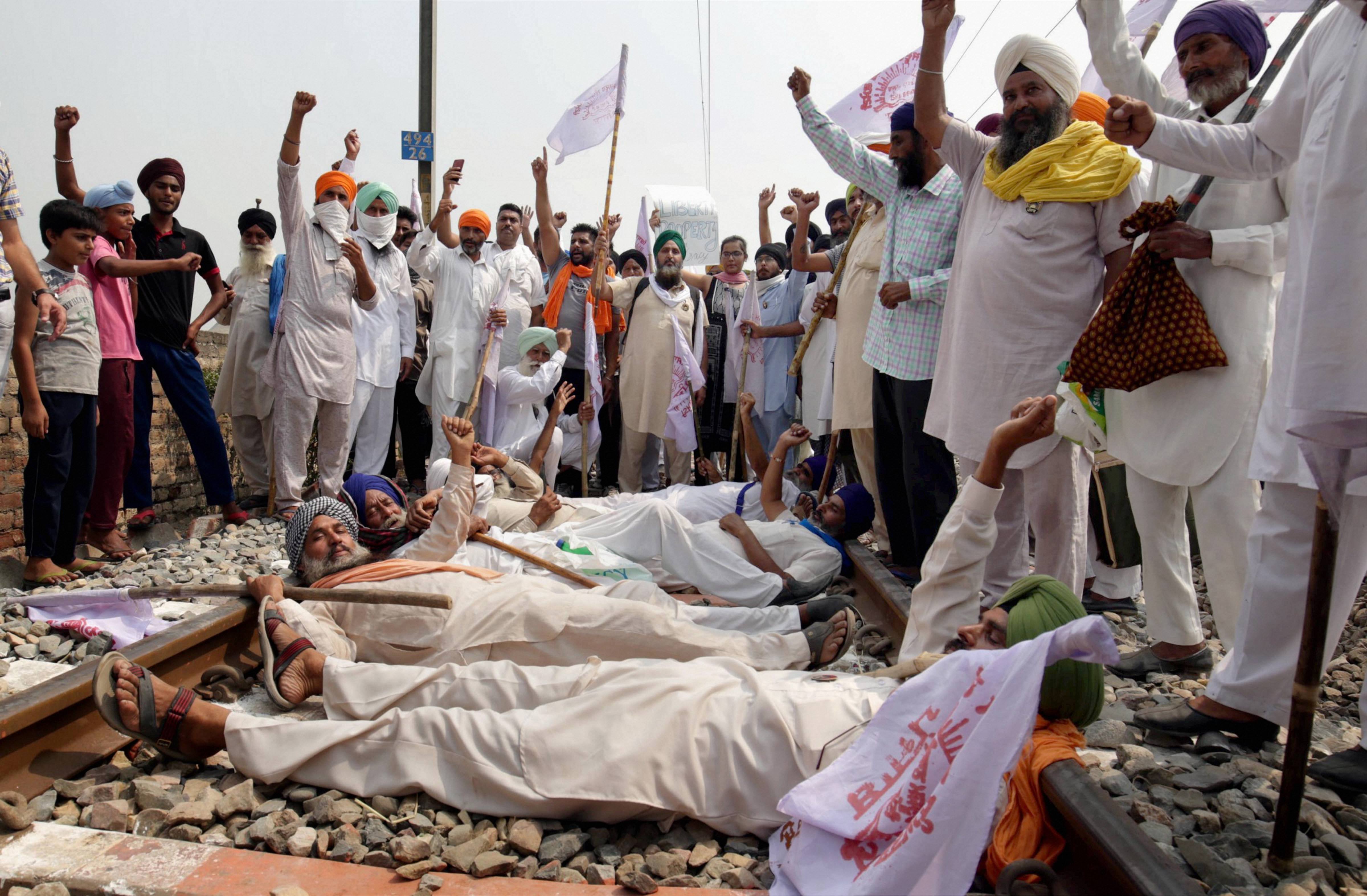 Amritsar: Farmers block a railway track as they participate in 'Rail Roko Andolan' during a protest against the farm bills passed in both the Houses of Parliament recently, at village Devi Dass Pura, about 20km from Amritsar, Thursday, Sept. 24, 2020. (PTI Photo)(PTI24-09-2020_000091B)