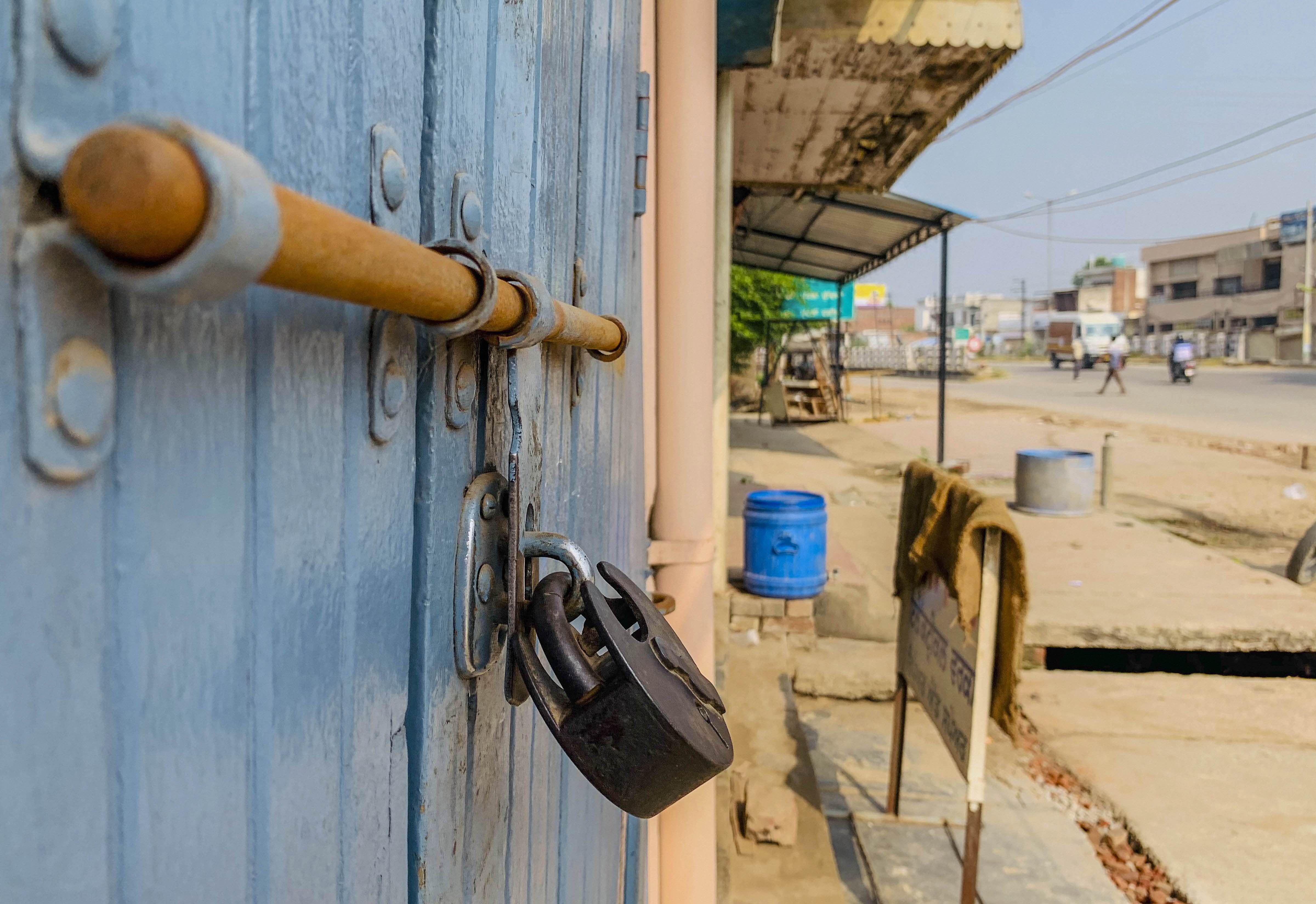 Kurali: A shop is locked during 'Bharat Bandh', a protest against the farm bills passed in Parliament recently, in Kurali, Friday, Sept. 25, 2020. (PTI Photo)(PTI25-09-2020_000040B)