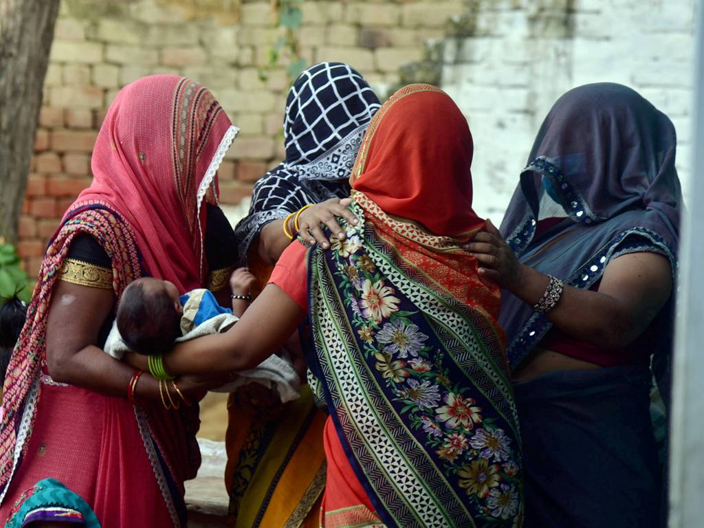 Hathras: Family members and relatives mourn the death of a 19-year-old woman, who was gang-raped two weeks ago, in Hathras district, Tuesday, Sept. 29, 2020. The Dalit teen died at a hospital in Delhi on Tuesday morning. (PTI Photo)(PTI29-09-2020 000173B
