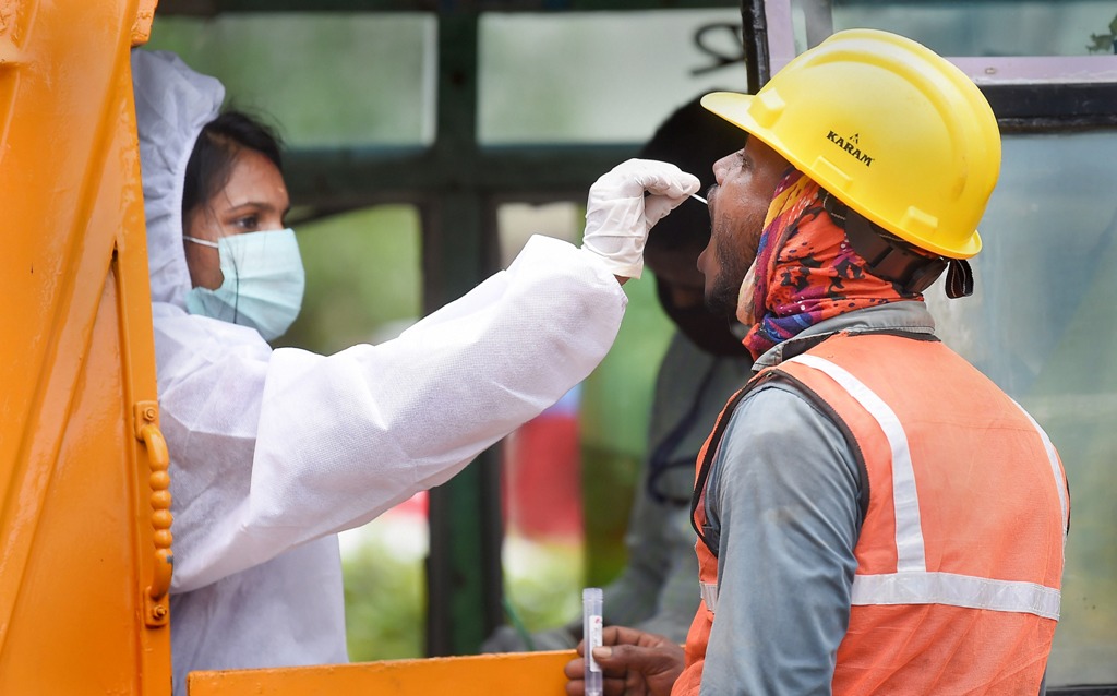 Chennai: A health worker collects swab sample from a migrant worker for COVID-19 test, in Chennai, Monday, Oct. 19, 2020. (PTI Photo/R Senthil Kumar)(PTI19-10-2020 000182B)