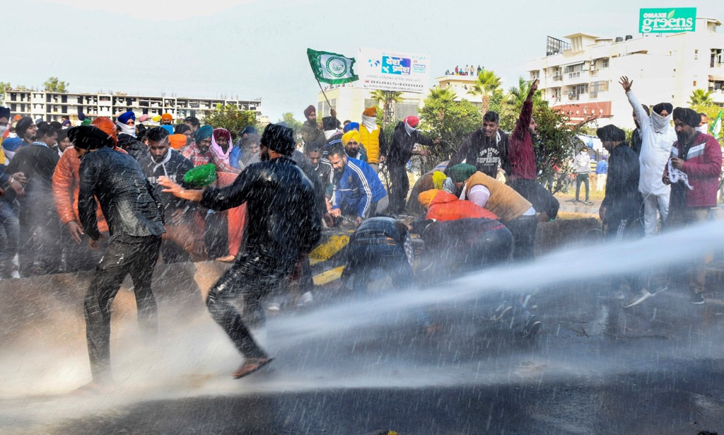 Ambala: Police personnel use water canons on farmers to stop them from crossing the Punjab-Haryana border during Delhi Chalo protest march against the new farm laws, near Ambala, Thursday, Nov. 26, 2020. (PTI Photo)(PTI26-11-2020 000140B)