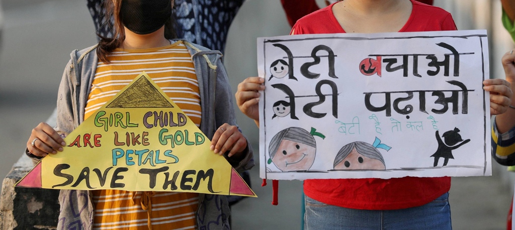 Jammu: Youngsters hold placards to create awareness on gender equality, ahead of the International Day of the Girl Child on Oct.11, in Jammu district, Saturday, Oct. 10, 2020. (PTI Photo)(PTI10-10-2020 000024B)