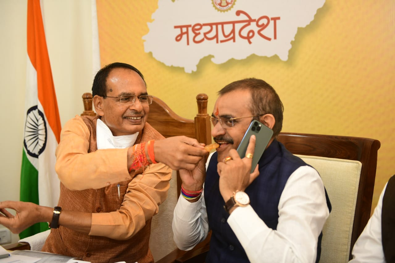 **EDS: TWITTER IMAGE POSTED BY @ChouhanShivraj ON TUESDAY, NOV. 10, 2020** Bhopal: Madhya Pradesh Chief Minister Shivraj Singh Chouhan and BJP State President VD Sharma greet each other as they celebrate their partys lead in Madhya Pradesh bypolls, in Bhopal. 