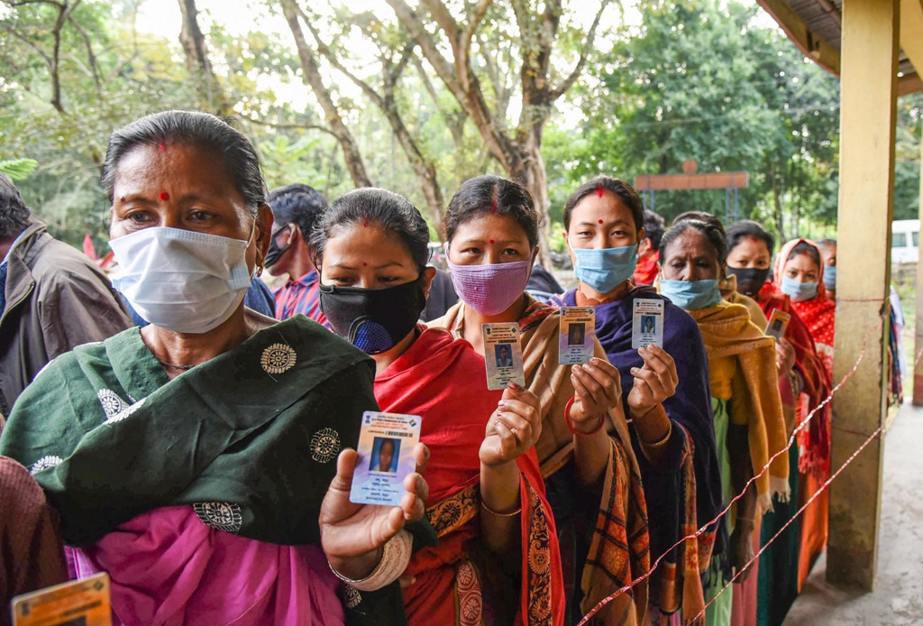 Baksa: Voters wait in a queue to cast their votes for Bodoland Territorial Regions (BTR) elections 2020, at a polling station at Uttarpara in Baksa district, Monday, Dec. 7, 2020. (PTI Photo) (PTI07-12-2020 000006B) 