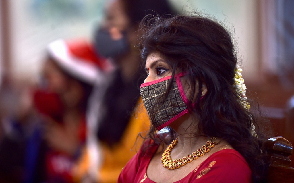 Chennai: A devotee wearing mask amid concern over the spread of coronavirus attends a mid-night Christmas mass service at Santhome Church, in Chennai, Friday, Dec. 25, 2020. (PTI Photo/R Senthil Kumar) (PTI25-12-2020 000073B)