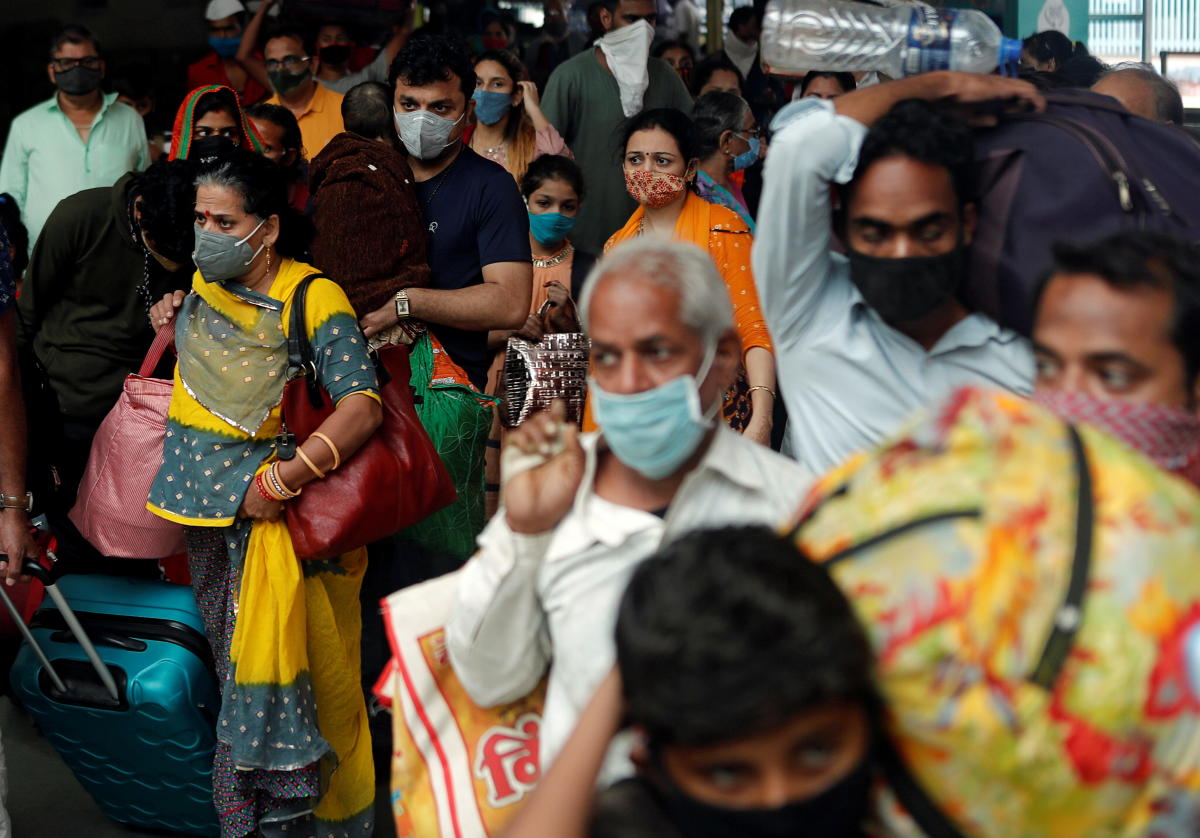 People wearing protective masks exit a railway station amid the spread of the coronavirus disease (COVID-19) in Mumbai, India, December 11, 2020. REUTERS/Francis Mascarenhas
