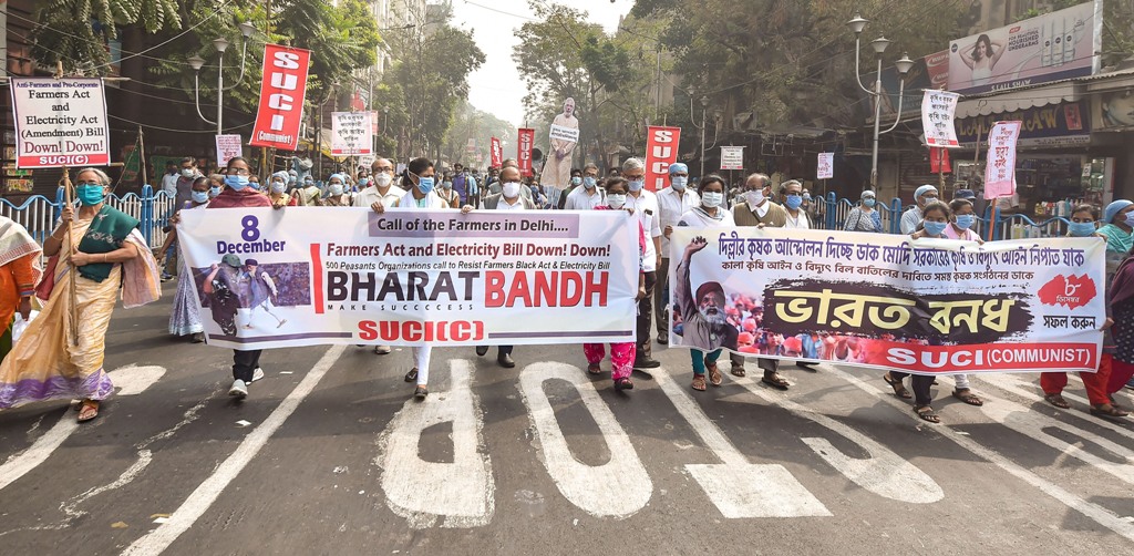Kolkata: Socialist Unity Centre of India (SUCI) activists participate in a rally in support of the nationwide strike, called by farmers to press for repeal of the Centres agri laws, in Kolkata, Tuesday, Dec. 8, 2020. (PTI Photo/Swapan Mahapatra)(PTI08-12-2020 000042B)