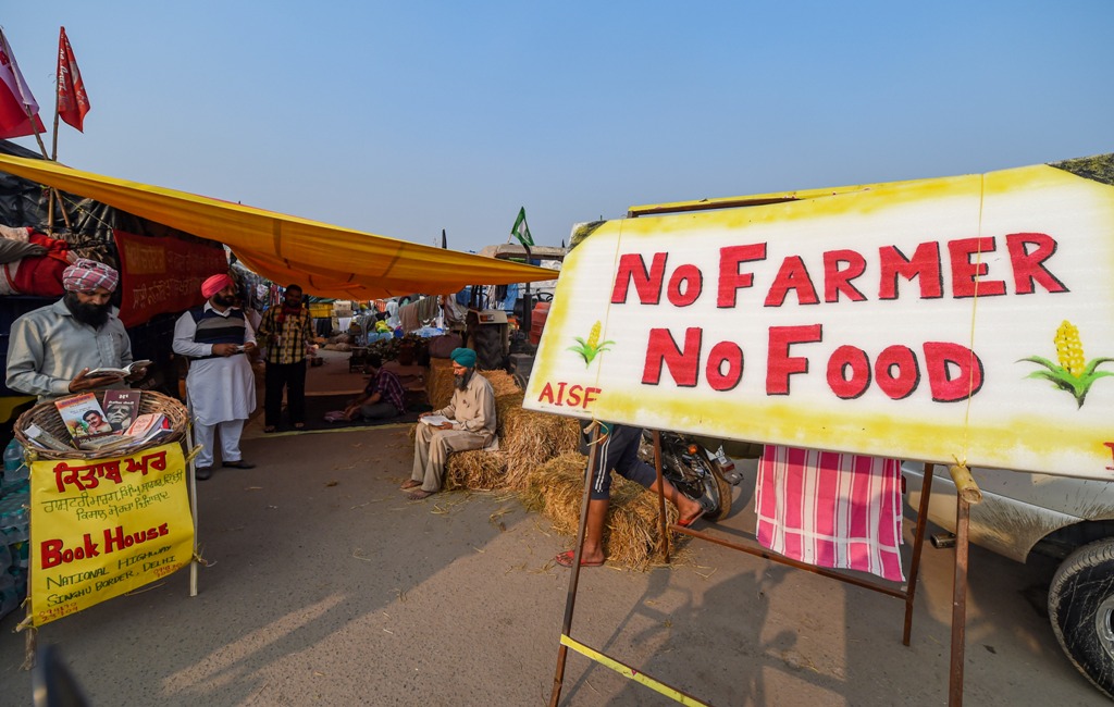 New Delhi: Farmers read books during their agitation against the new farm laws, at Singhu border in New Delhi, Sunday, Dec. 6, 2020. (PTI Photo/Manvender Vashist) (PTI06-12-2020 000225B)