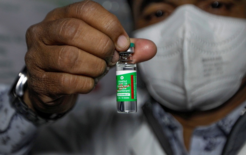 Ahmedabad: A health worker shows the Covishield vaccine, after arrival of the first batch of the vaccines from the Serum Institute of India at the Civil Hospital, in Ahmedabad, Tuesday, Jan. 12, 2021. (PTI Photo) (PTI01 12 2021 000044B)