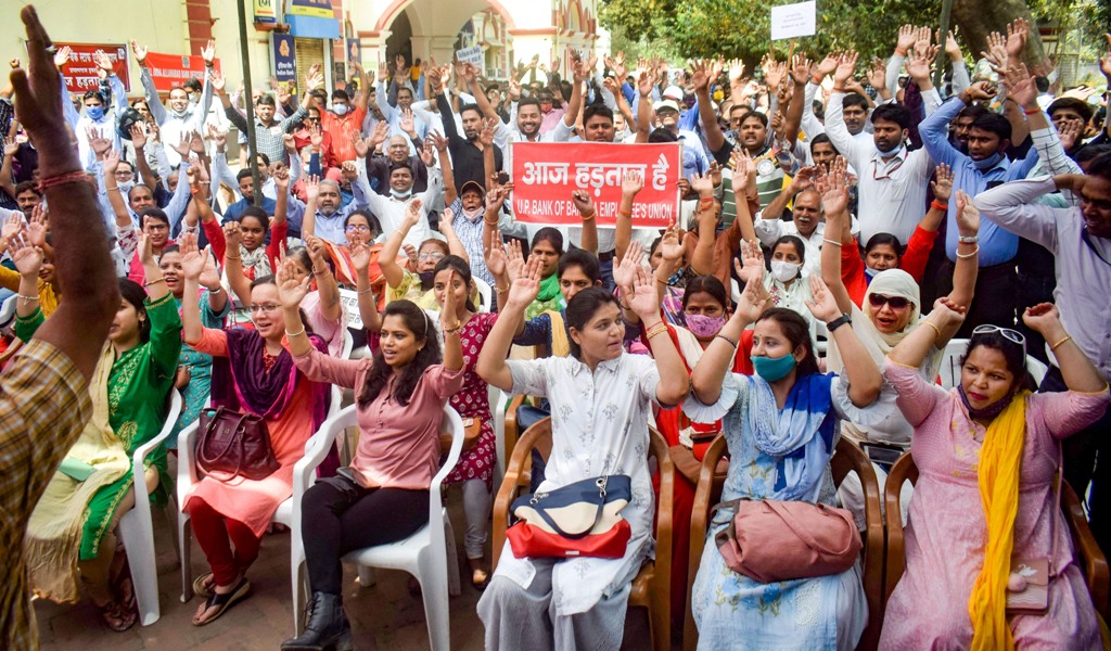 Prayagraj: Bank employees raise slogans during the second day of a nationwide strike, called by United Forum of Bank Unions (UFBU), against the proposed privatisation of two state-owned lenders, in Prayagraj, Tuesday, March 16, 2021. (PTI Photo)(PTI03 16 2021 000090B)