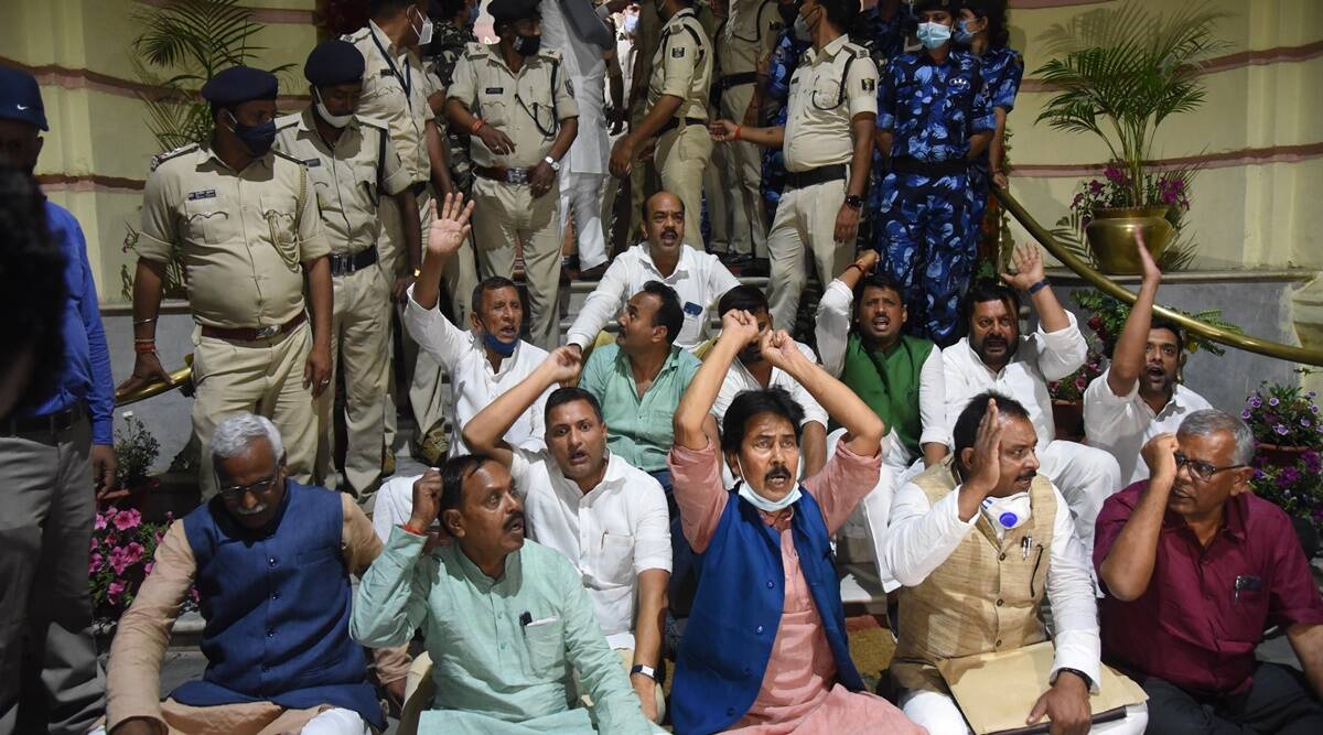 Grand Alliance legislators stage a dharna in the main entrance of Bihar Assembly during Budget session, in Patna, Tuesday, March 23, 2021. Photo: PTI